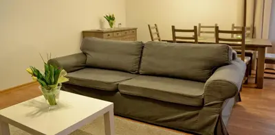 a living room with a couch and a table at 777 Apartaments in Kraków