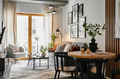 a living room with a couch and a table at Main Station Art Apartment in Kraków
