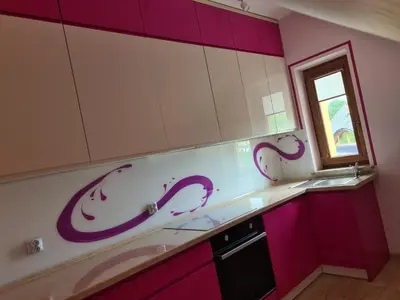 a kitchen with purple and white cabinets and a window at MARMI Noclegi in Golczowice