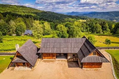 an overhead view of a house with a roof at Loft Na Stodole z jaskinią SPA - Osada Jaworzyny in Zawadka