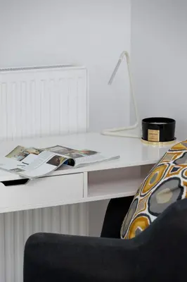 a white desk with a chair and a book on it at City Centre & Modern Quiet Apartment with Parking by Renters Prestige in Kraków