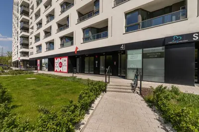 a building with a bike parked in front of it at City Centre & Modern Quiet Apartment with Parking by Renters Prestige in Kraków