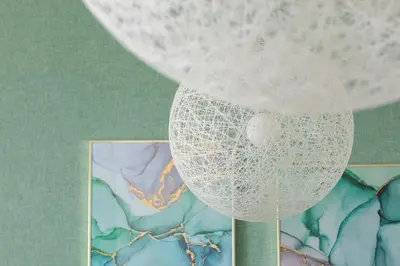 a white net ball on a stand next to a picture at Grzegórzki Park Unique Apartment Cracow by Renters Prestige in Kraków