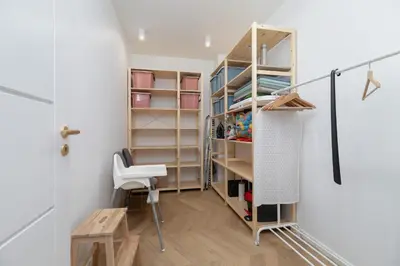 a room with a closet with a desk and a chair at Grzegórzki Park Unique Apartment Cracow by Renters Prestige in Kraków