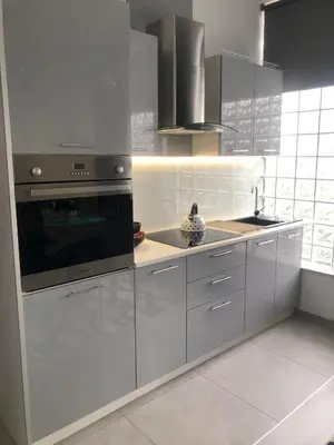 a kitchen with stainless steel cabinets and a stove at Apartamenty MAX blisko Energylandia in Ryczów