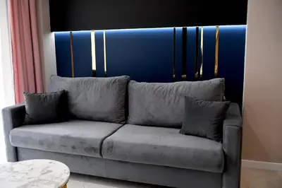 a dining room with a black table and chairs at CoCo Elite Apartments Zator in Zator