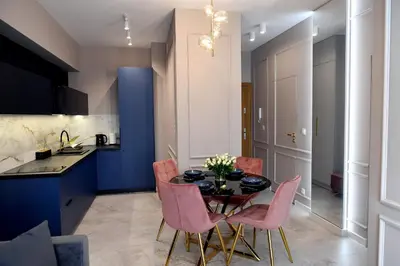 a dining room with a table and chairs at CoCo Elite Apartments Zator in Zator