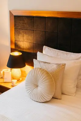 a hotel room with a bed with a pillow on it at Topolowa Residence by StayLab in Kraków