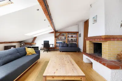 a living room with a couch and a fireplace at Karmelicka 34 by Homeprime in Kraków