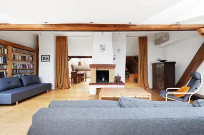 a living room with blue couches and a fireplace at Karmelicka 34 by Homeprime in Kraków