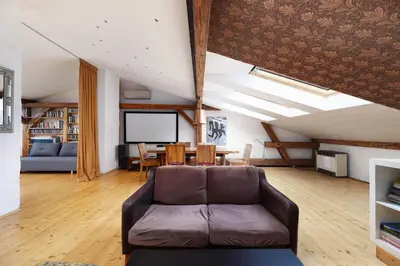 a living room with a couch and a table at Karmelicka 34 by Homeprime in Kraków