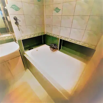 a bathroom with a bath tub and a sink at Sienna 3 OLD TOWN in Kraków
