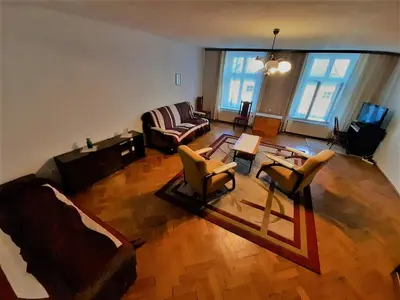 a living room with two chairs and a couch at Sienna 3 OLD TOWN in Kraków