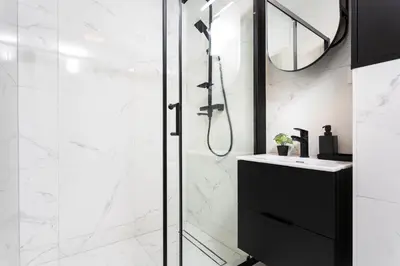a bathroom with a shower and a sink at Cosy Corner - Kraków, Krowodrza - by Upstairs in Kraków