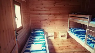 a room with two bunk beds and a window at Gościniec nad Zalewem Sosina in Jaworzno
