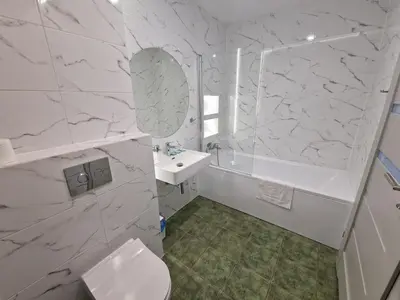 a white bathroom with a sink and a mirror at Gościniec nad Zalewem Sosina in Jaworzno