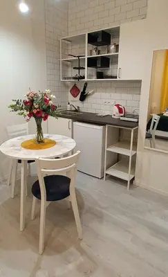 a bedroom with a large bed with towels on it at Central Cracow Apartments in Kraków