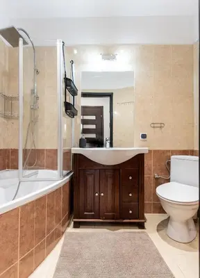 a bathroom with a sink and a tub and a toilet at Lubomirskiego 9 in Kraków