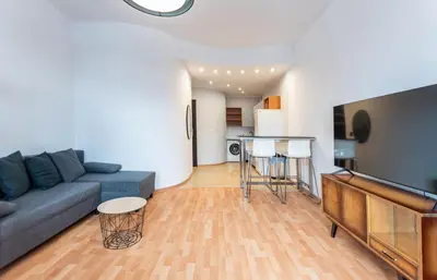 a living room with a couch and a table at Lubomirskiego 9 in Kraków