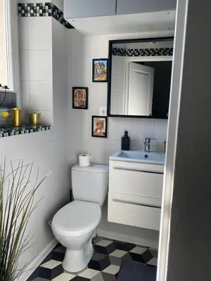 a bathroom with a white toilet and a sink at Jewish District in Krakow/ Kraków Kazimierz in Kraków
