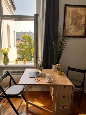 a desk with a laptop on it in front of a window at Jewish District in Krakow/ Kraków Kazimierz in Kraków