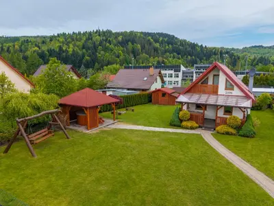 an aerial view of a yard with a house at Kamyczkowy domek w Zawoi in Zawoja