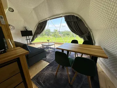 a room with a table and chairs and a window at Glamp Delux Ojcowski Park Narodowy in Wola Kalinowska