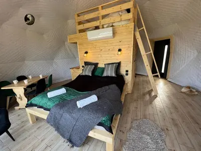 a bedroom with a bed in a yurt at Glamp Delux Ojcowski Park Narodowy in Wola Kalinowska