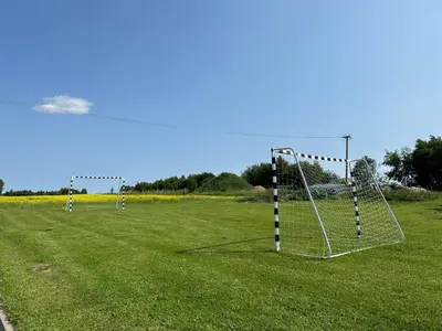two goal posts in a field with a soccer field at Glamp Delux Ojcowski Park Narodowy in Wola Kalinowska