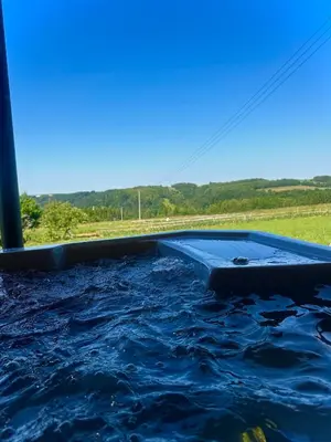 a pool of water on the side of a road at Glamp Delux Ojcowski Park Narodowy in Wola Kalinowska