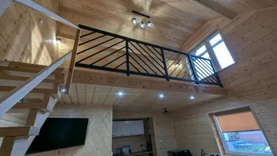 a room with a bed in a wooden wall at Domek wypoczynkowy Górskie Zacisze in Sidzina