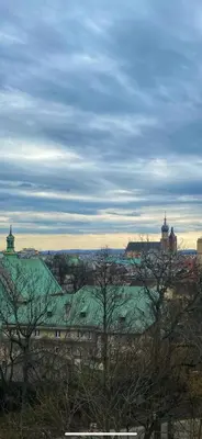 a view of a city with a green roof at Small room for short stay in Kraków