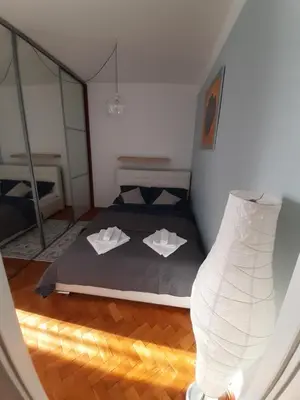 a bedroom with a bed with two white pillows at Max Apartament okolice Energylandia Zator in Oświęcim