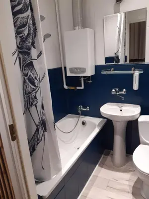 a bathroom with a tub and a sink and a toilet at Max Apartament okolice Energylandia Zator in Oświęcim