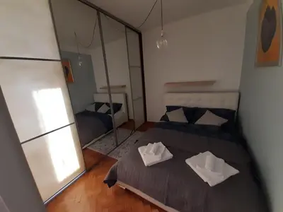 a bedroom with two beds and a mirror at Max Apartament okolice Energylandia Zator in Oświęcim