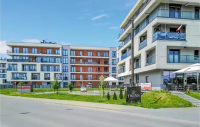 an apartment building with a no parking sign in front of it at 1 Bedroom Amazing Apartment In Zator in Zator