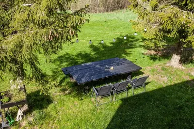 an overhead view of a picnic table and chairs in a field at Dom na Wielkiej Polanie in Sidzina