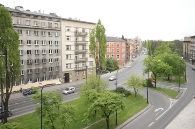 a view of a city street with cars on the road at Aleja Słowackiego 18 by Homeprime in Kraków