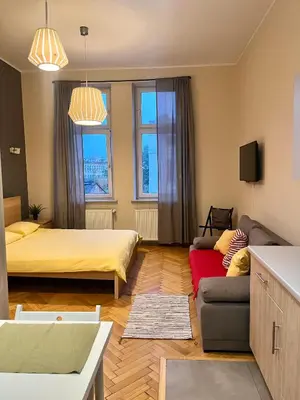 a bathroom with a shower and a toilet at Cheerful Corner in Kraków