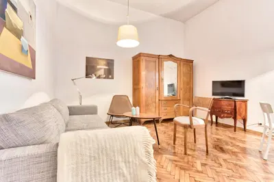 a living room with a couch and a table at Zacisze Street in Kraków