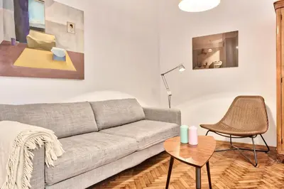 a living room with a couch and a table at Zacisze Street in Kraków