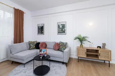 a living room with a couch and a table at Old Town Długa 48 Family Apartment by Noclegi Renters in Kraków