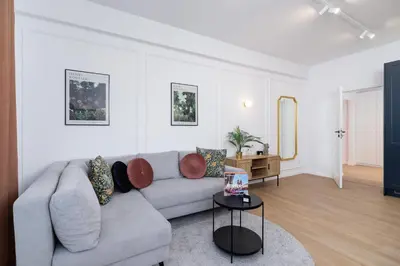 a living room with a couch and a table at Old Town Długa 48 Family Apartment by Noclegi Renters in Kraków