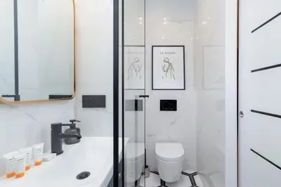 a bathroom with a sink and a toilet at Old Town Długa 48 Family Apartment by Noclegi Renters in Kraków
