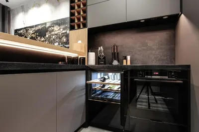 a kitchen with a black oven in a counter at EXCLUSIVE APARTMENTS ZATOR in Zator