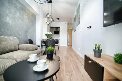 a living room with a couch and a table at Just 5 by Housine in Zator