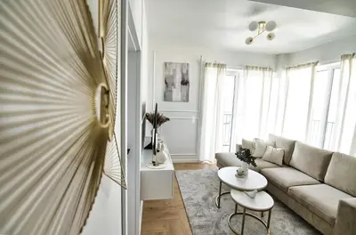 a living room with a couch and a table at Azyl by Housine in Zator
