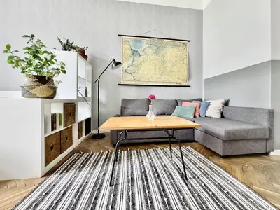a living room with a couch and a table at GREEN APARTMENTS #Kazimierz, building A in Kraków
