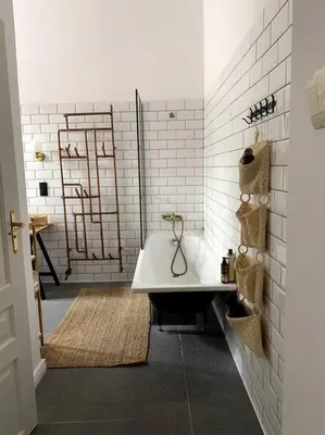 a bathroom with a bath tub and a sink at In the heart of old town in Kraków