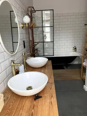 a bathroom with a sink and a bath tub at In the heart of old town in Kraków